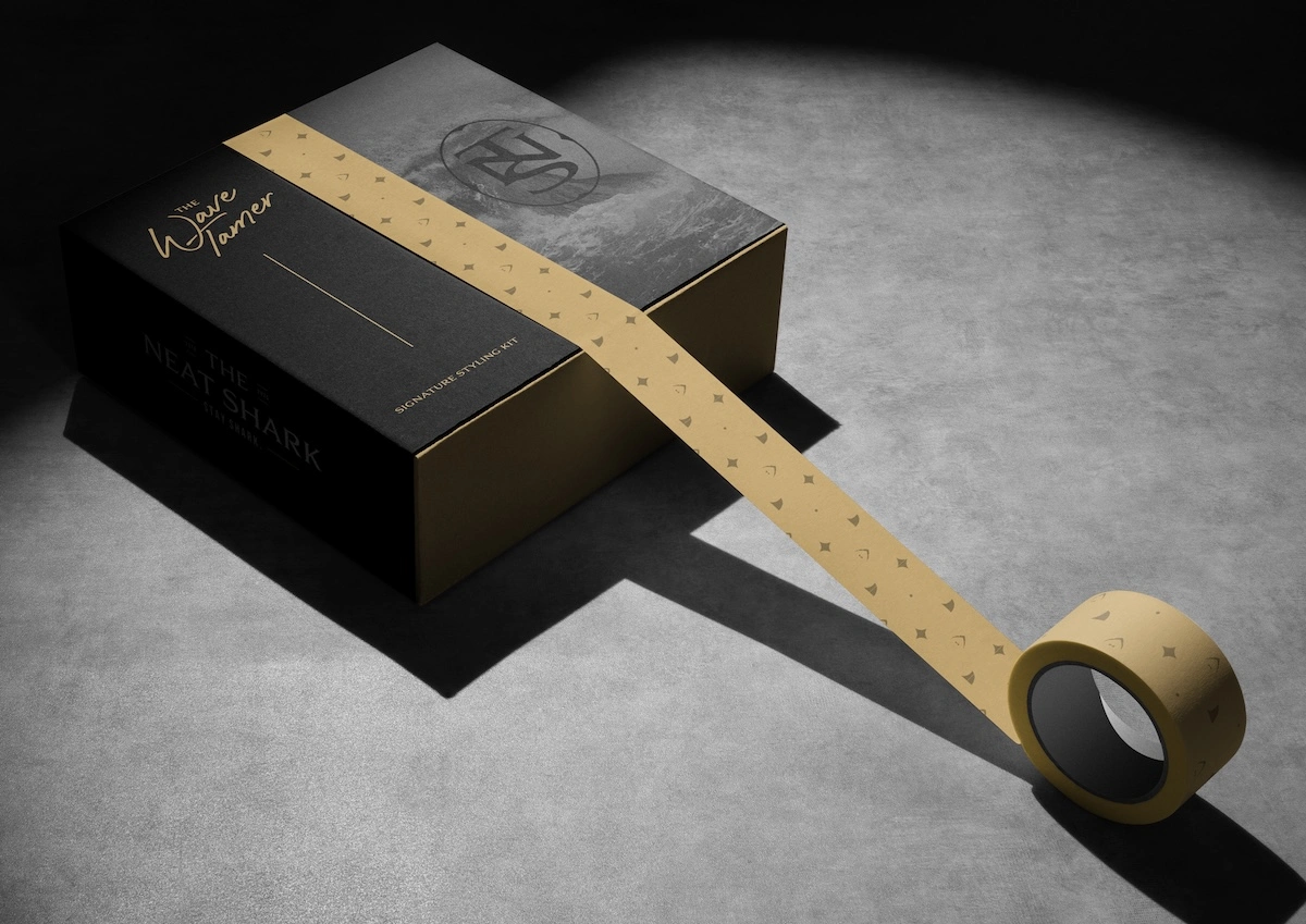The Wave Tamer Signature Styling Kit — premium black and gold magnetic-close gift box